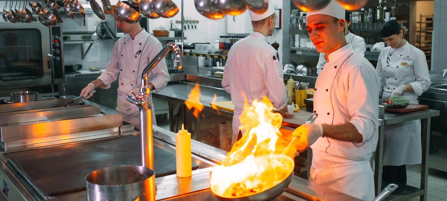 Chefs working in a land-based commercial restaurant kitchen